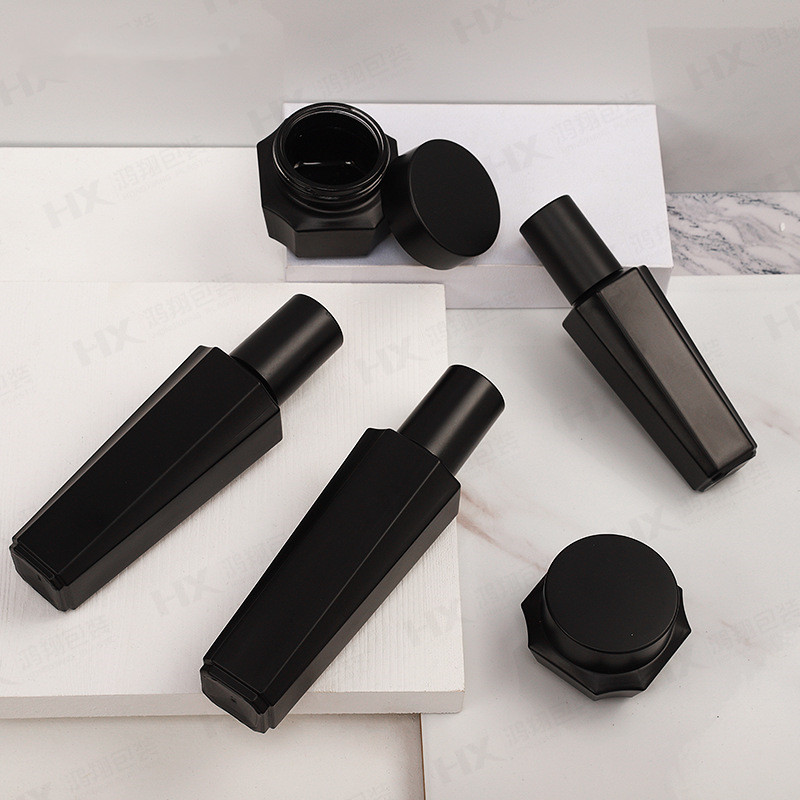 Custom logo black hexagon glass bottle and jar cosmetic package container with black cap for skin care package in good price