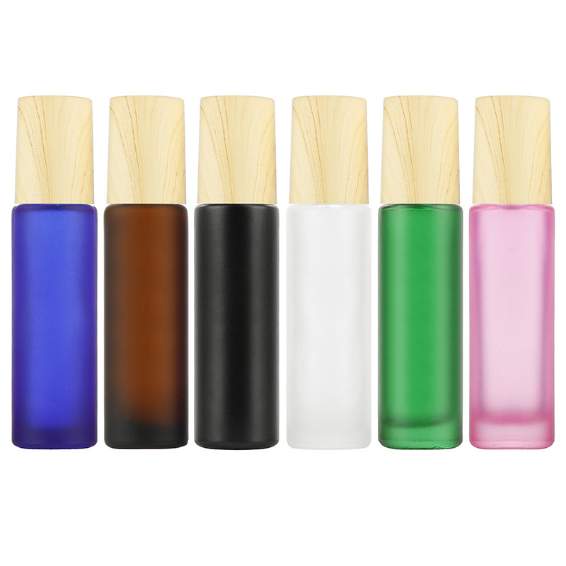 Custom logo colorful 10ml roll ball bottle with wood grain cap cosmetic package container for eye cream bottle in good price