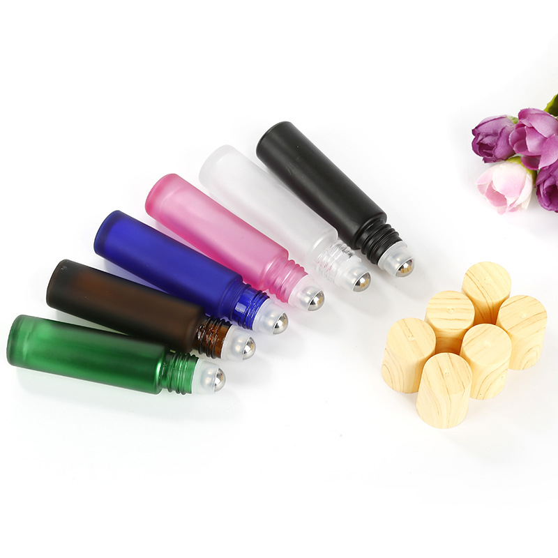 Custom logo colorful 10ml roll ball bottle with wood grain cap cosmetic package container for eye cream bottle in good price