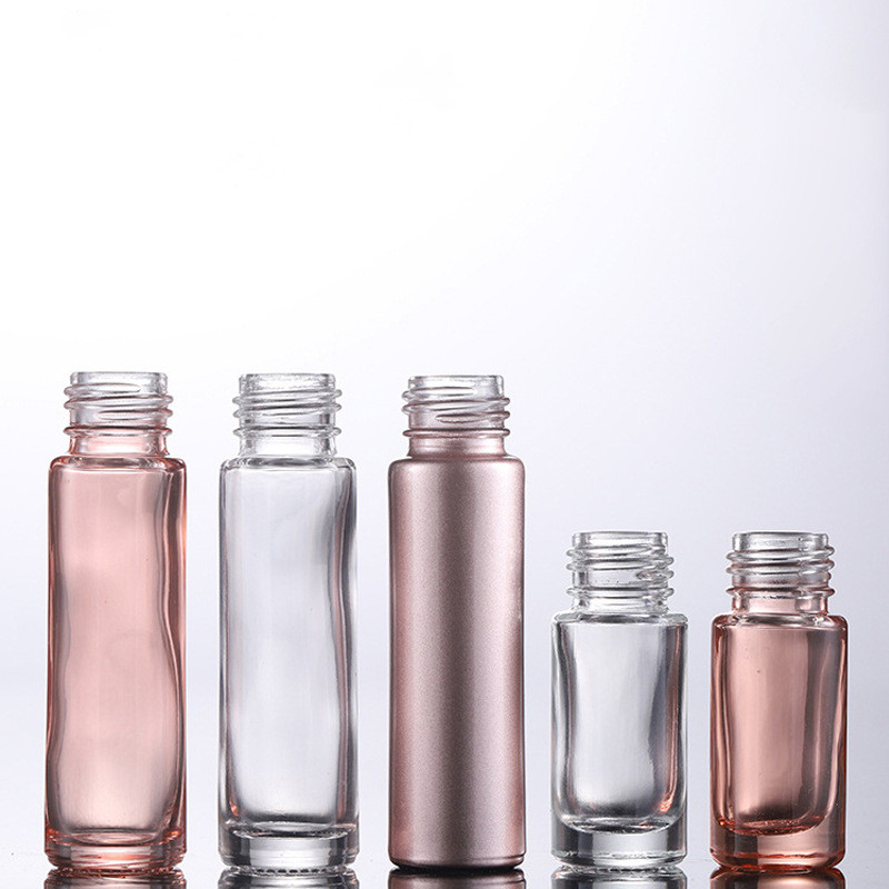 Custom logo eye cream high-end 10ml 5ml rose gold glass toller ball bottle with matte rose pink cap cosmetic package container