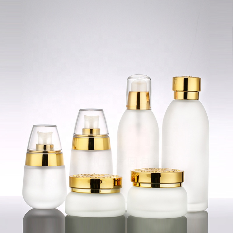 Custom logo golden carved ABS cap 120ml 100ml 50ml 30ml 30g 50g frosted glass bottle and jar cosmetic container package
