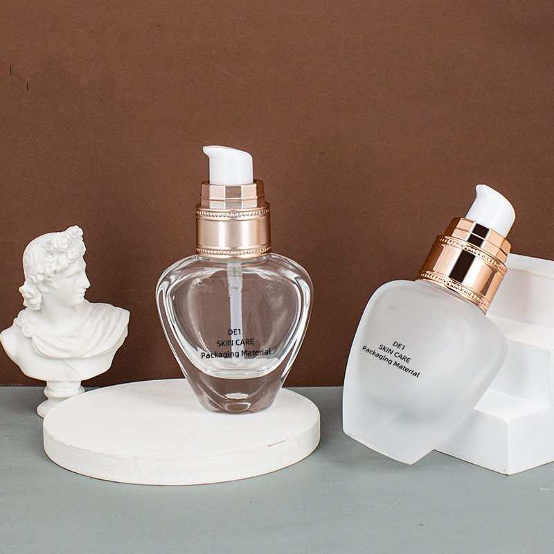 Custom logo luxury 30ml unique shape glass pump bottle cosmetic package for liquid foundation with diamond cap in good price