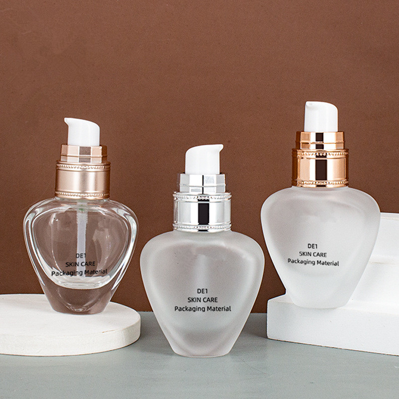 Custom logo luxury 30ml unique shape glass pump bottle cosmetic package for liquid foundation with diamond cap in good price