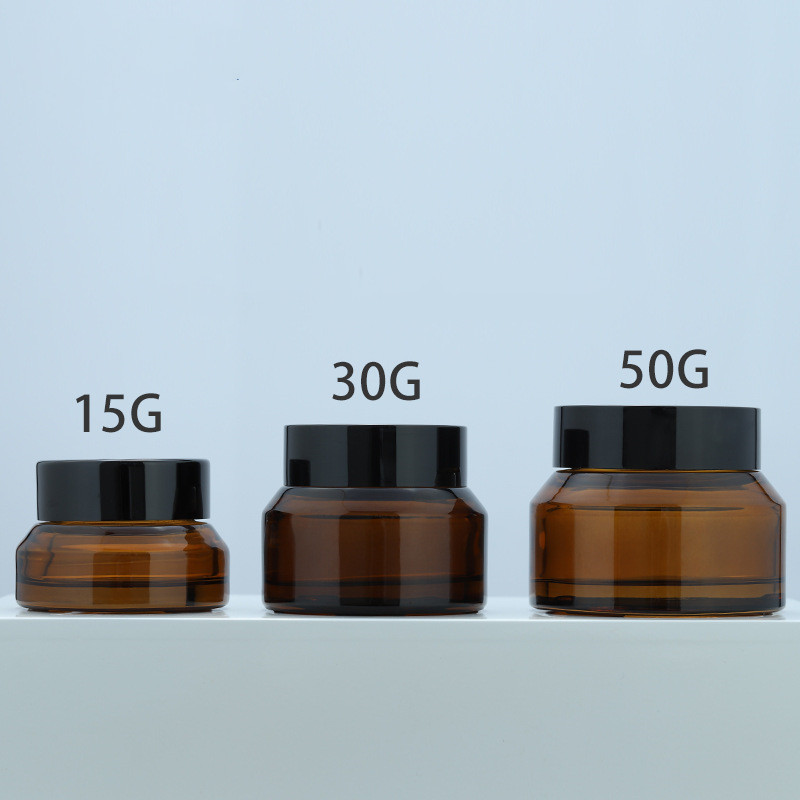 Custom logo small package 15g 30g 50g brown glass jar with black cap for cosmetic facial essence cream in good price