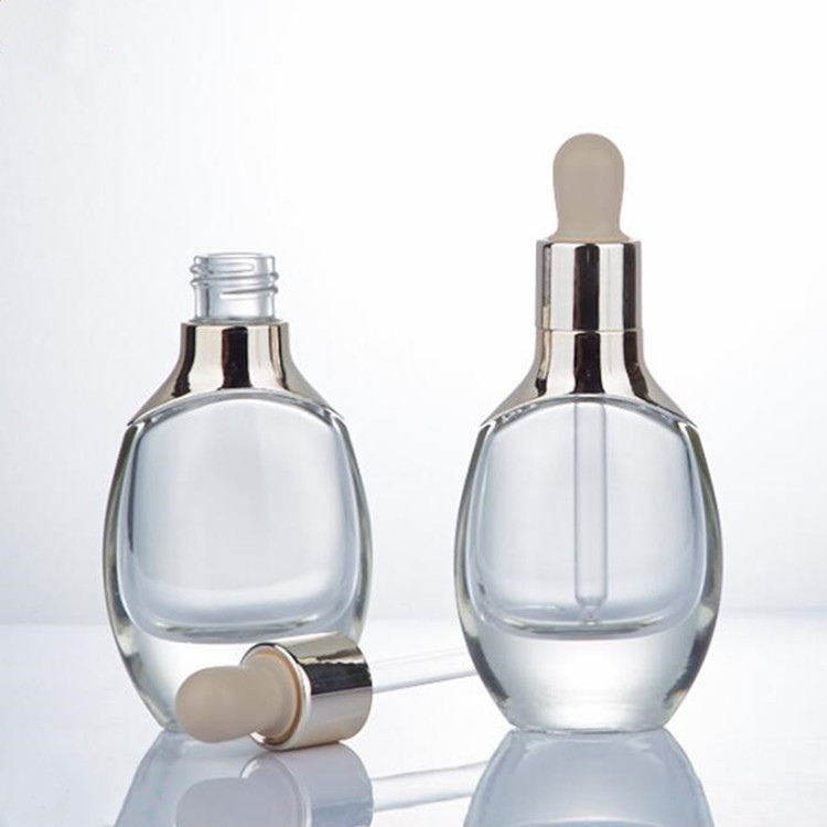 Custom luxury cosmetic packaging aluminum shoulder oval clear white glass Essential Oil dropper Bottle with silver or gold cap
