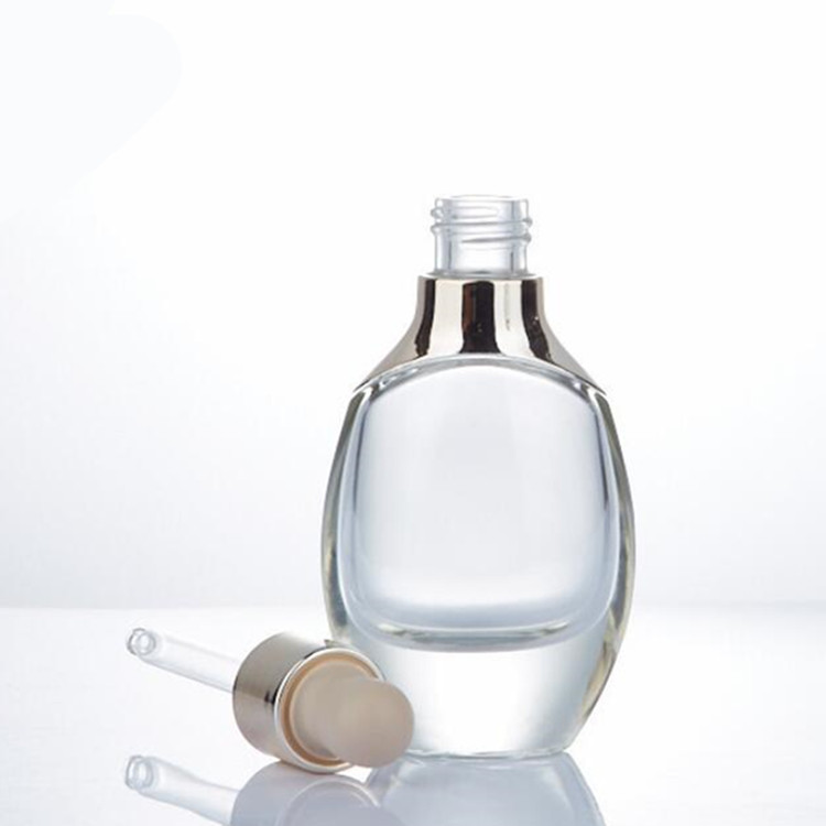 Custom luxury cosmetic packaging aluminum shoulder oval clear white glass Essential Oil dropper Bottle with silver or gold cap