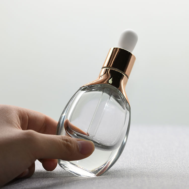 Custom luxury cosmetic packaging aluminum shoulder oval clear white glass Essential Oil dropper Bottle with silver or gold cap
