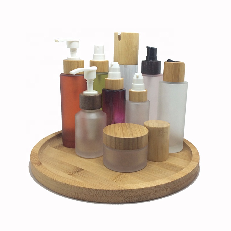 Custom made environment-friendly wooden bamboo glass cosmetic bottles, including tree box packaging, carving customer trademarks