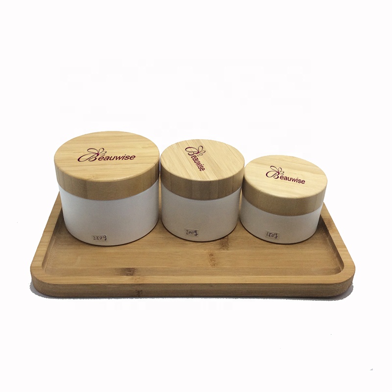 Custom made environment-friendly wooden bamboo glass cosmetic bottles, including tree box packaging, carving customer trademarks