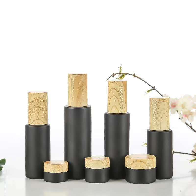 Custom made lotion container 30 ml 50 ml 100 ml bamboo cosmetic packaging face cream black glass jars with bamboo wood lid