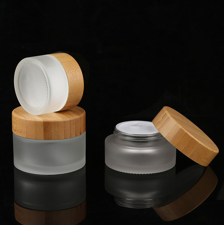 Custom made lotion container 30 ml 50 ml 100 ml bamboo cosmetic packaging face cream frosted glass jars with bamboo wood lid