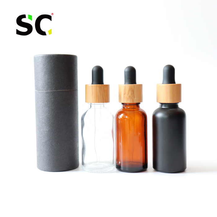 Custom paper cardboard tube 1 ounce clear glass bottles 30ml tincture oil bottles bamboo cap/lid