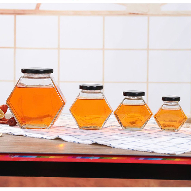 Customize Multiple Capacity100ml 180ml 280ml 380ml Hexagonal Glass Jar Packaging with Lids