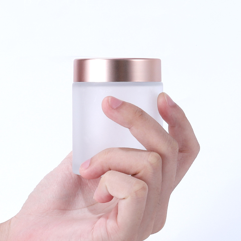 Customized 50g straight side matte frosted cosmetic bottle weed packaging smellproof container CBD glass jar with rose good caps