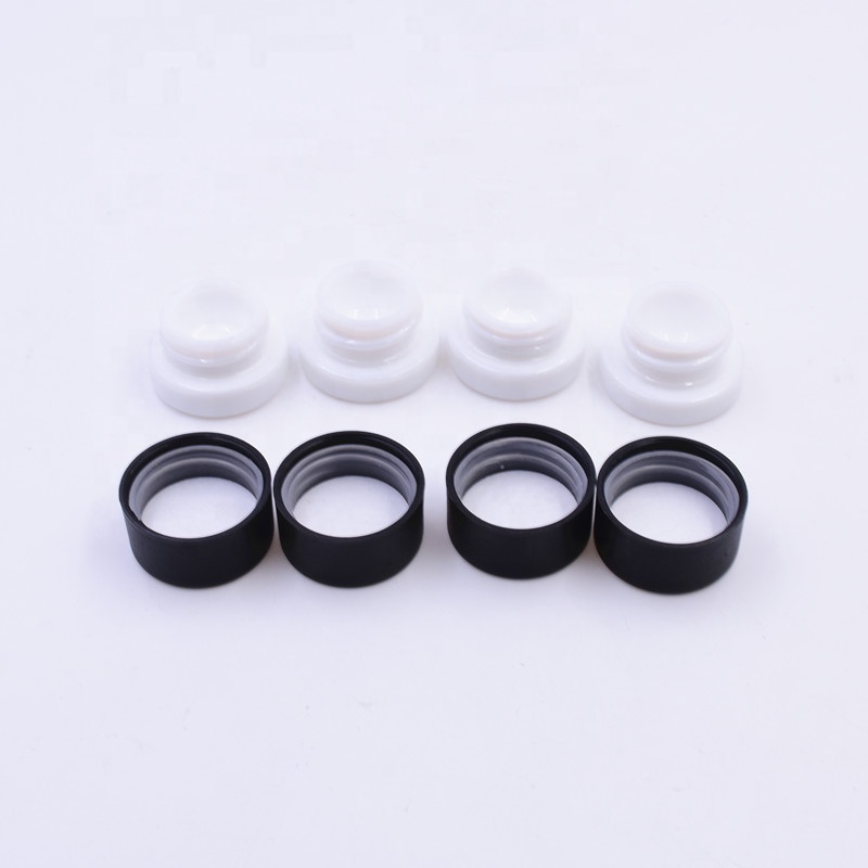 Cute 3 ml white round small straight side eye cream cosmetic packing glass jar with black plastic child proof lid.