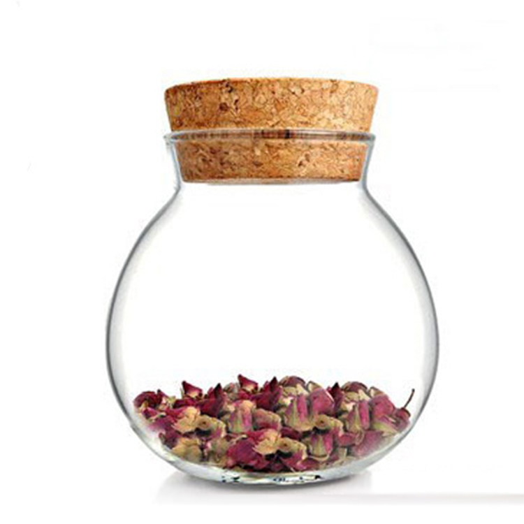 Delicate round glass storage bottle with cork cover