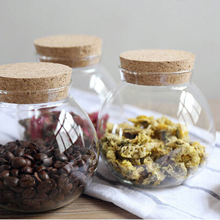 Delicate round glass storage bottle with cork cover