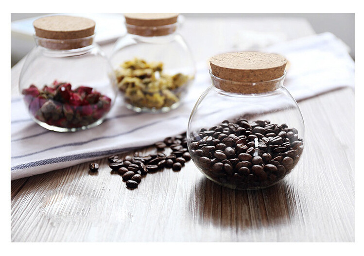 Delicate round glass storage bottle with cork cover