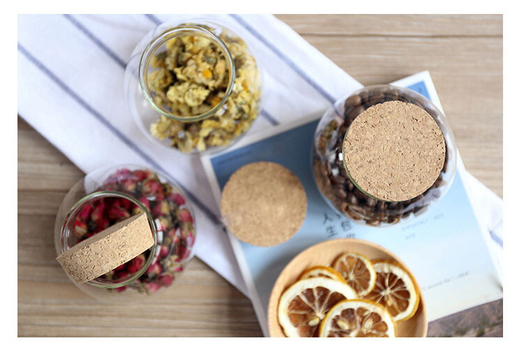 Delicate round glass storage bottle with cork cover