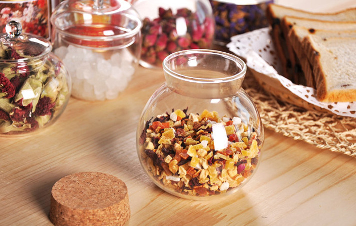 Delicate round glass storage bottle with cork cover