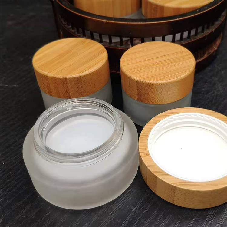 Eco friendly 30g 50g frosted transparent Refillable Glass Face Cream Pot Cosmetics Container Jar with bamboo cap