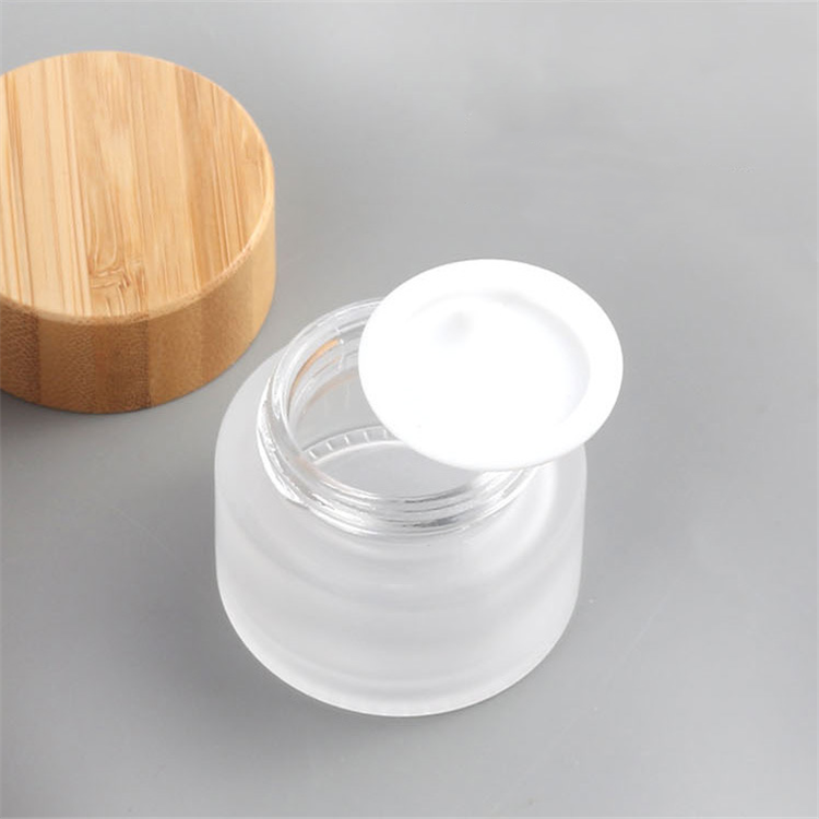 Eco friendly frosted matte clear amber green blue black glass bamboo lid jar for cosmetic cream jars container