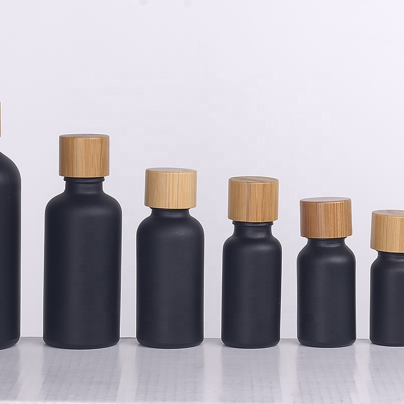 Eco-friendly matte black glass 30ml 50ml 60ml essencial oil bottle with bamboo caps