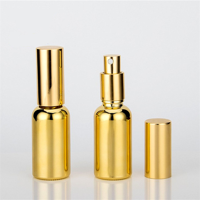 Electroplated gold glass bottle essential oil 20 ml spray bottle with golden Childproof cap
