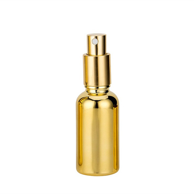 Electroplated gold glass bottle essential oil 20 ml spray bottle with golden Childproof cap