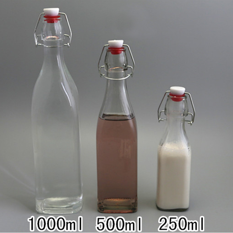 Empty 16oz carbonated amber beer glass bottle with swing cap/flip top