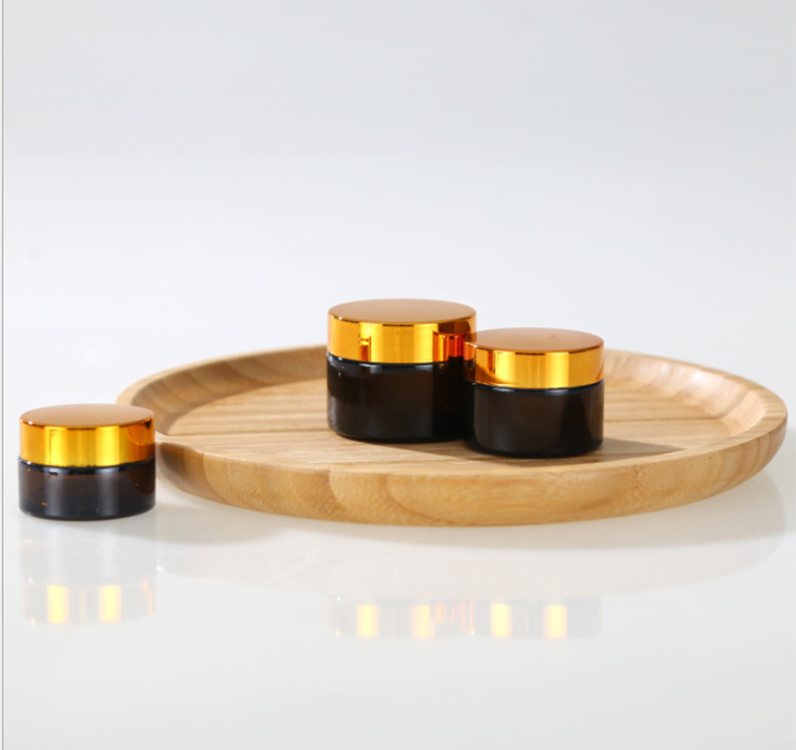 Empty 20g 30g 50g amber glass cosmetic jar container with black gold lid for lotion