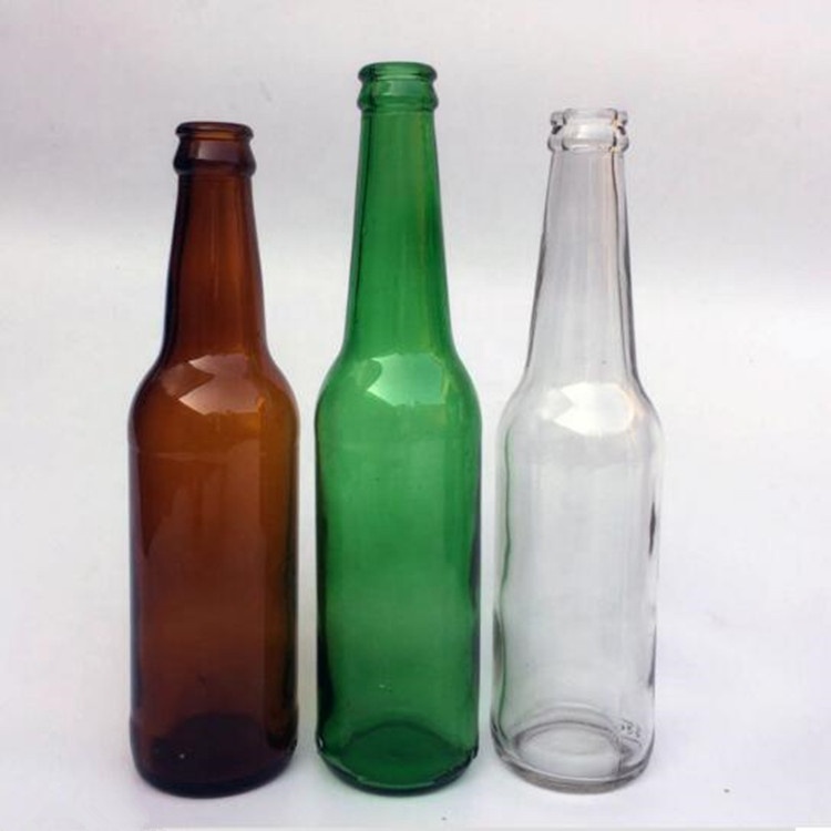 Empty 330ml clear amber green glass beer bottle with 26mm crown cap