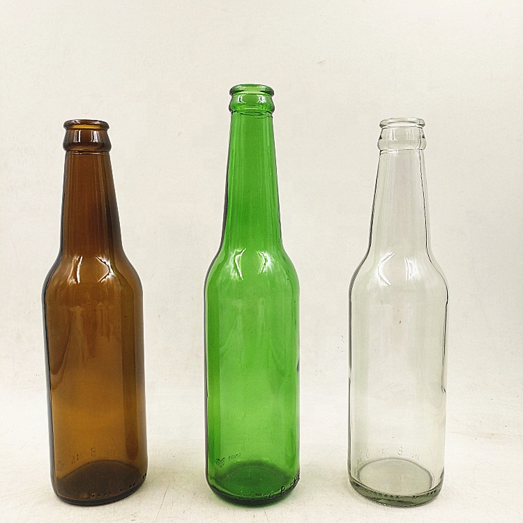 Empty 330ml clear amber green glass beer bottle with 26mm crown cap