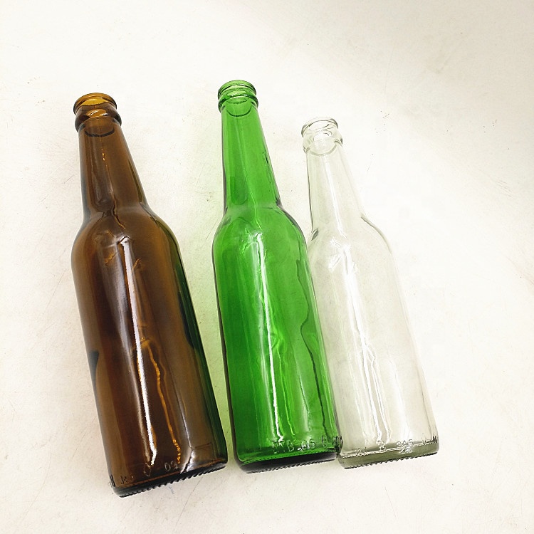 Empty 330ml clear amber green glass beer bottle with 26mm crown cap