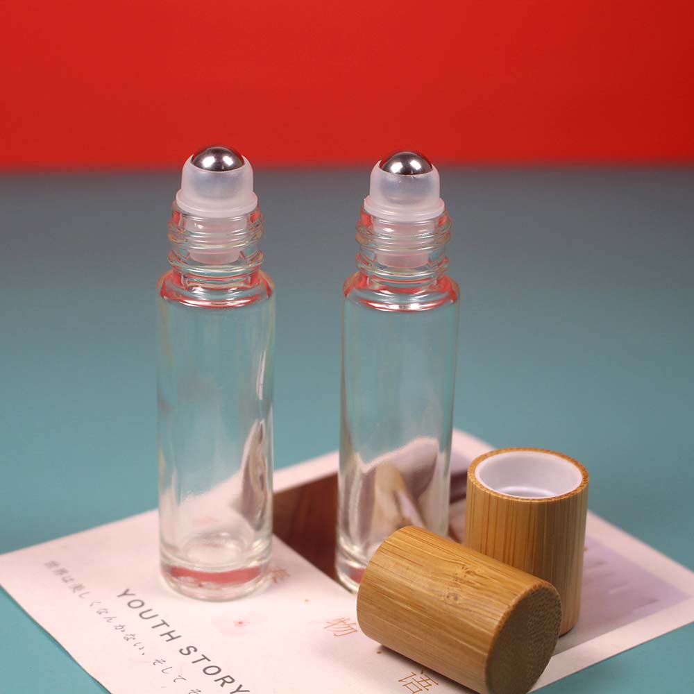 Empty bamboo cap glass roll on bottle with stainless roller ball