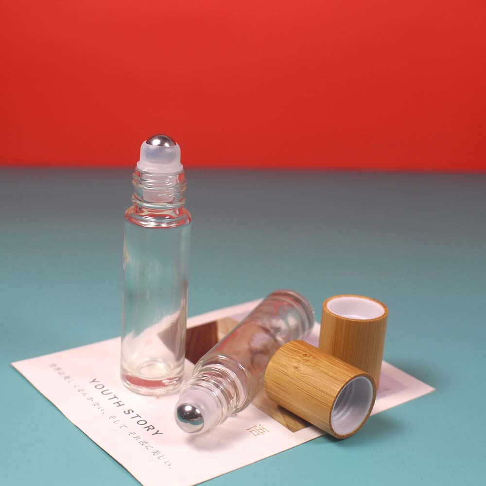 Empty bamboo cap glass roll on bottle with stainless roller ball