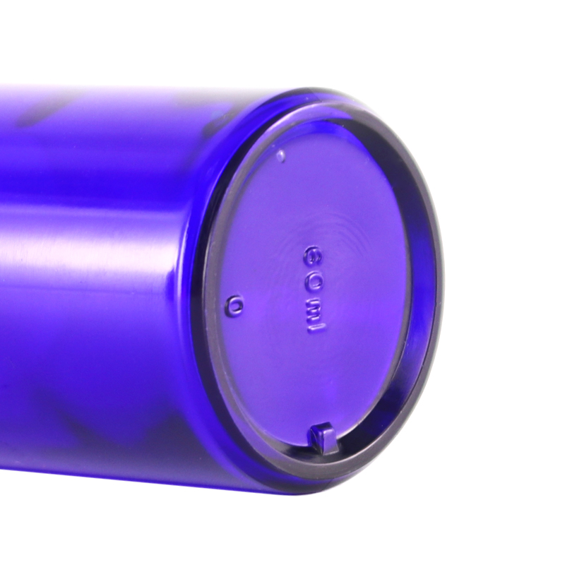 Empty cobalt blue glass cosmetic lotion pump bottles