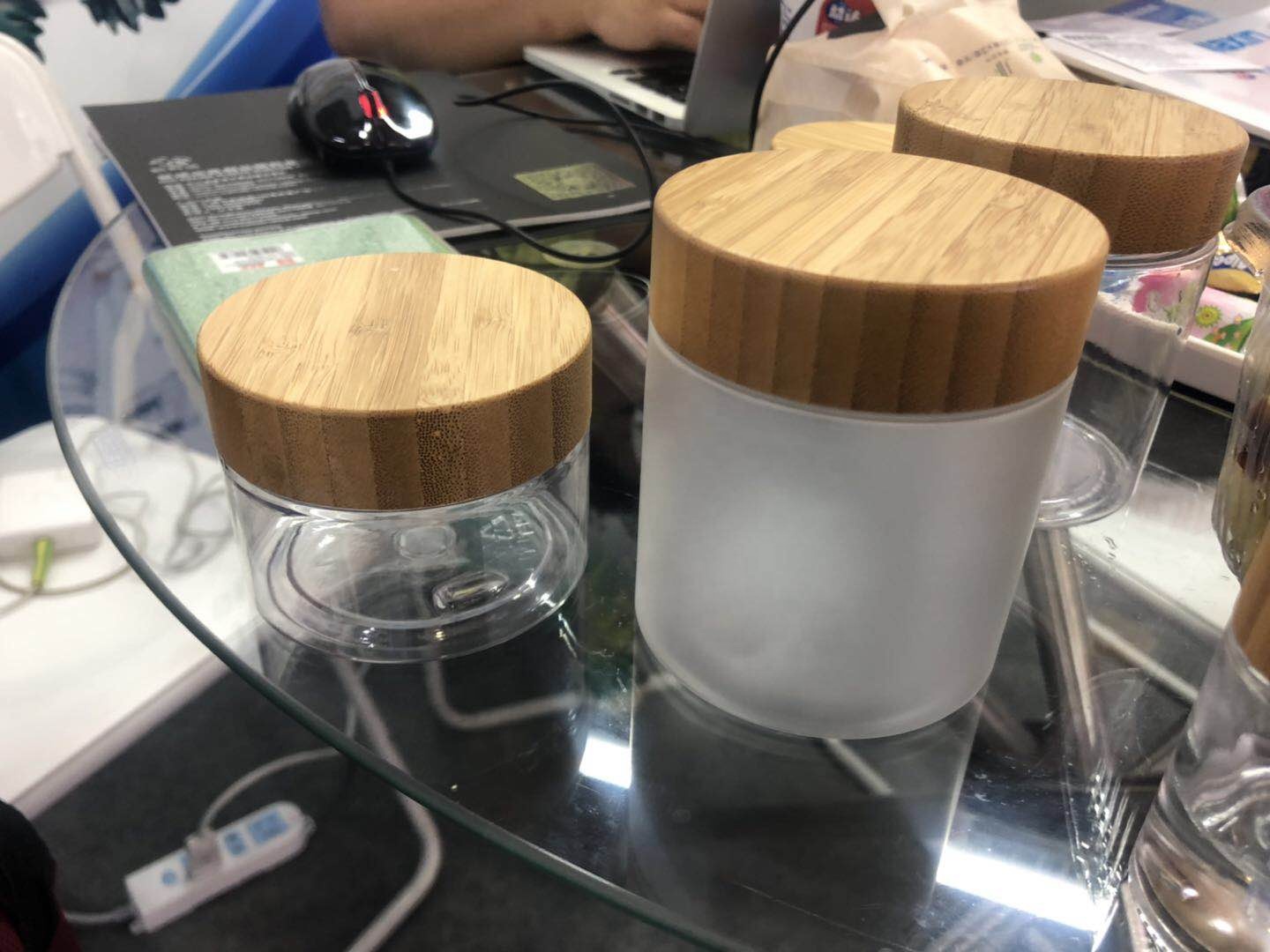 Empty cosmetic container 50ml 150ml 250ml 500ml clear frosted PET plastic jar with bamboo wood lids