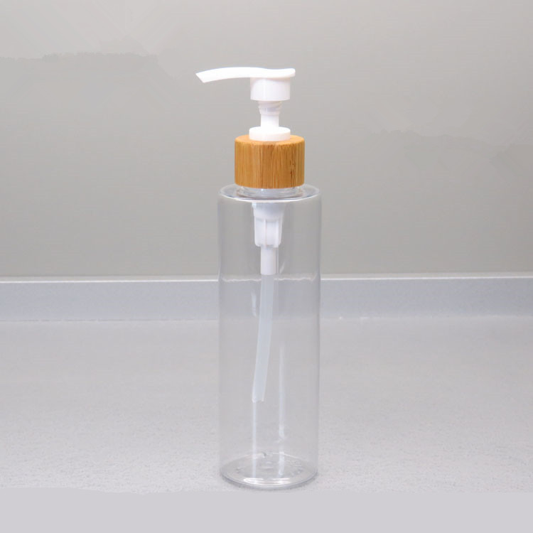 Empty cosmetic facial lotion bottle 50ml 200ml clear amber cream pump pet lotion bottle with bamboo cap