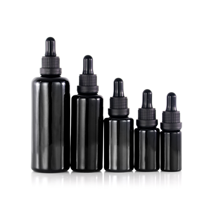 Empty dark violet glass essential oil dropper bottle with tamper evident cap