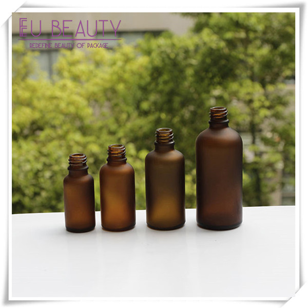 Empty frosted amber glass dropper bottle