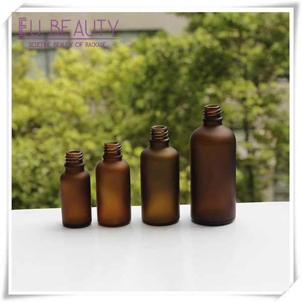 Empty frosted amber glass dropper bottle