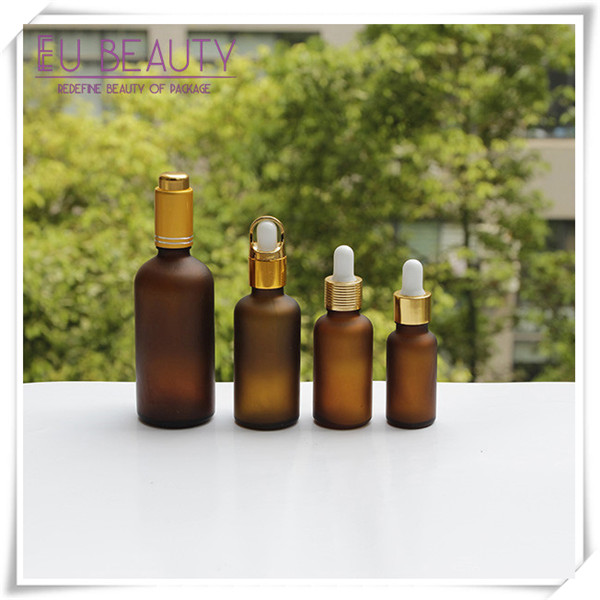 Empty frosted amber glass dropper bottle