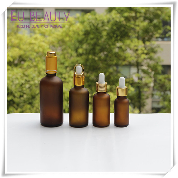 Empty frosted amber glass dropper bottle