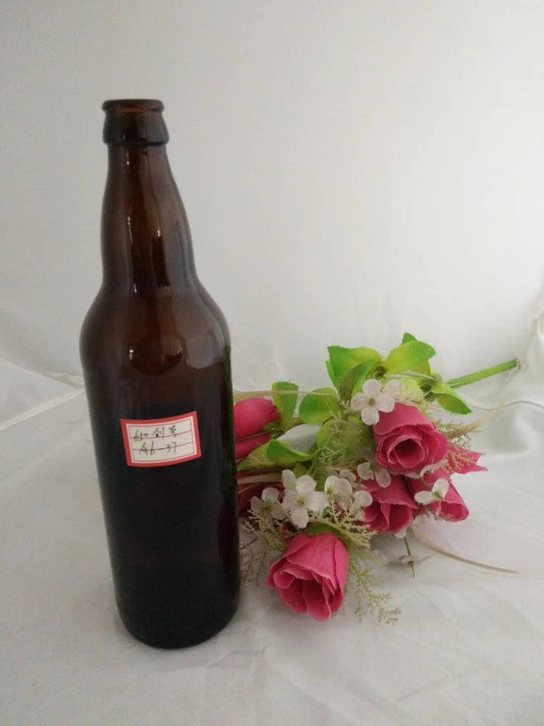 Empty glass beer bottle factory price 33cl 330ml 500ml 650ml with metal crown cap