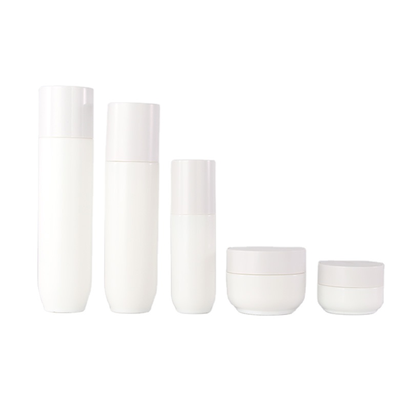 Empty opal white glass cosmetic pump lotion bottle and ceramic cream jar