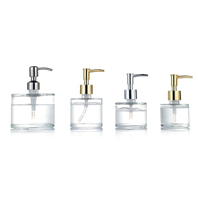 Empty round glass liquid bottle with Stainless steel pump for hand soap
