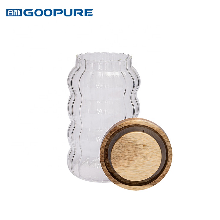 Empty stylish striped borosilicate glass storage jar