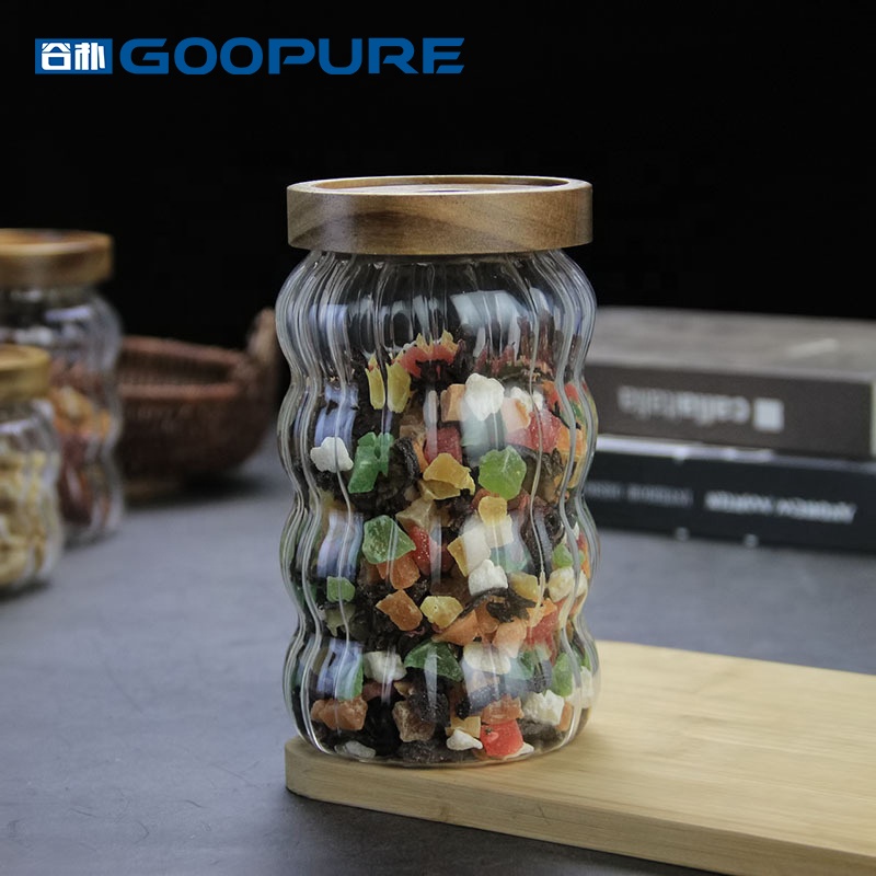 Empty stylish striped borosilicate glass storage jar