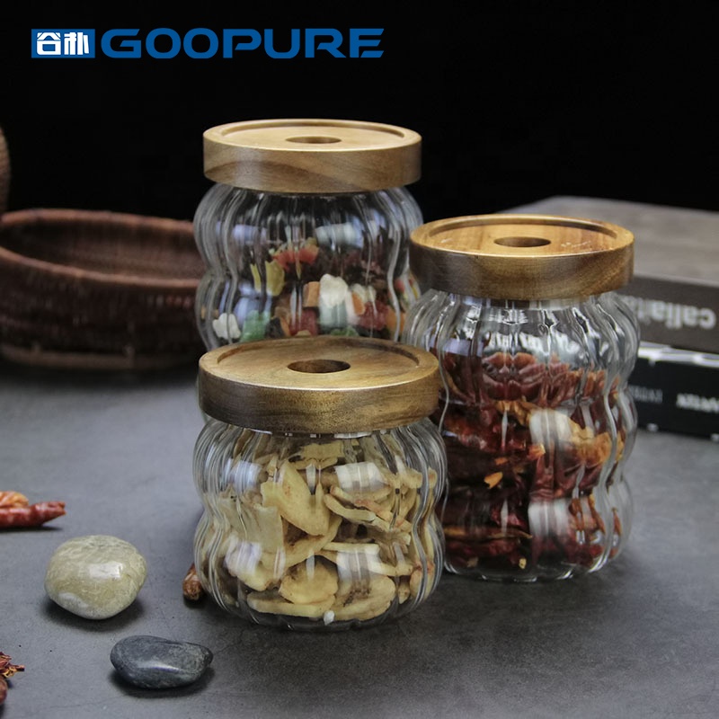 Empty stylish striped borosilicate glass storage jar